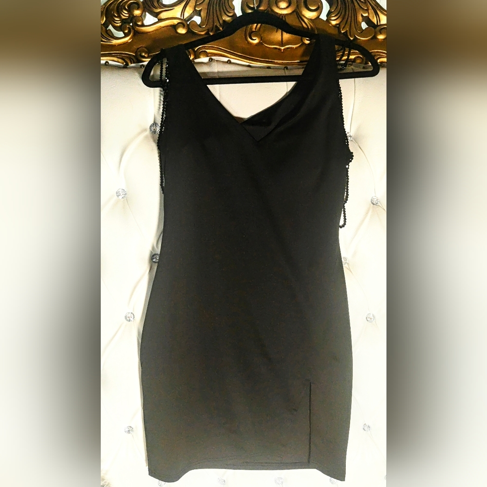 Black thigh length dress with beeding details